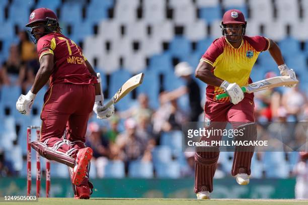 West Indies' Kyle Mayers and West Indies' Johnson Charles run between the wickets during the second T20 international cricket match between South...