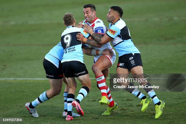 Paul Vaughan of the Dragons is tackled during the round five NRL match between the St George Illawarra Dragons and the Cronulla Sharks at...
