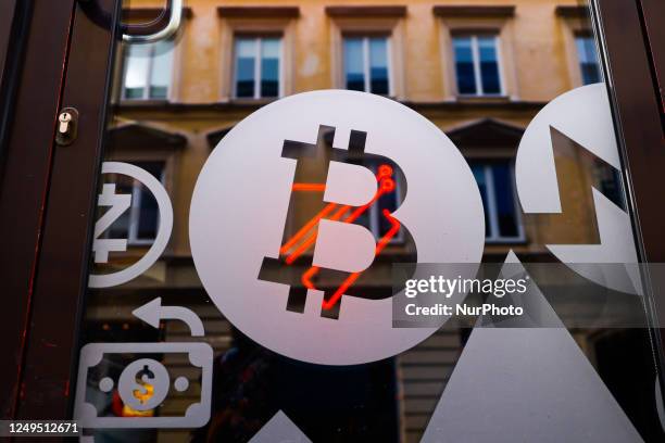 Bitcoin symbol is seen on a money exchange point in Warsaw, Poland on March 26, 2023.