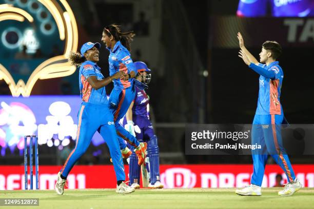 Isabelle Wong of Mumbai Indians celebrates the wicket of Alice Capsey of Delhi Capitals during the Women's Premier League final match between Delhi...