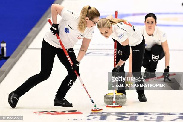 Carole Howald, Briar Schwaller-Huerlimann and Carole Howald of Switzerland compete during the gold medal game between Norway and Switzerland of the...