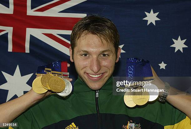Ian Thorpe of Australia poses with the six gold medals and one silver medal he won during the 2002 Commonwealth Games, Manchester, England on August...