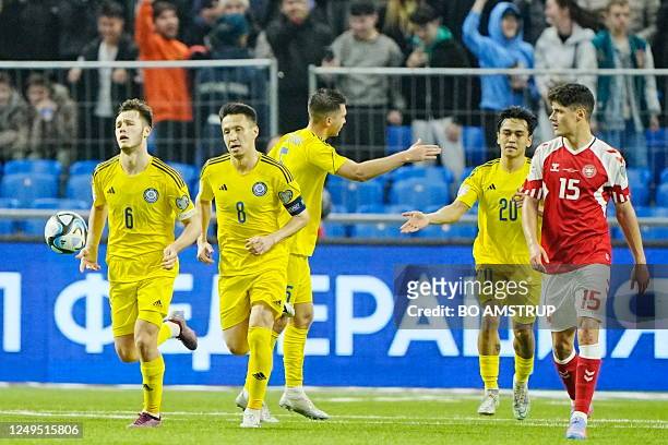 Kasakhstan's players celebrate after scoring during the UEFA Euro 2024 Group H qualification football match Kasakhstan v Denmark in Astana,...
