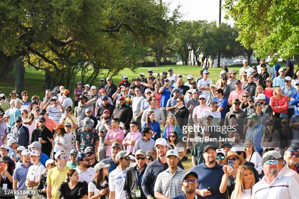Fans stand near the first tee box during the final day of the World Golf Championships-Dell Technologies Match Play at Austin Country Club on March...
