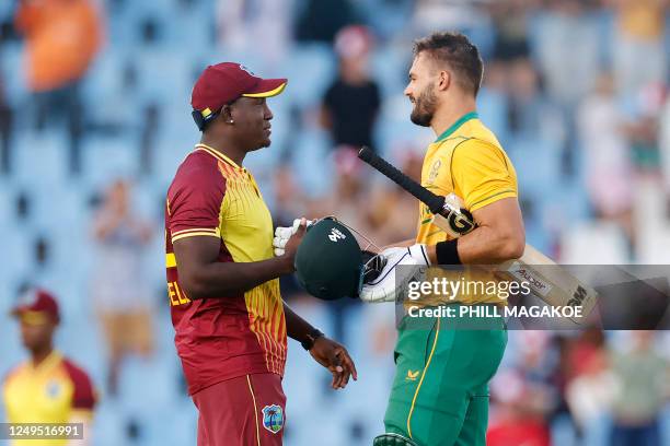 West Indies' Rovman Powell congratulates South Africa's Aiden Markram after South Africa won the second T20 international cricket match between South...