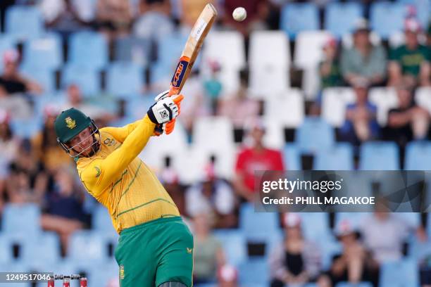 South Africa's Heinrich Klaasen watches the ball after playing a shot during the second T20 international cricket match between South Africa and West...