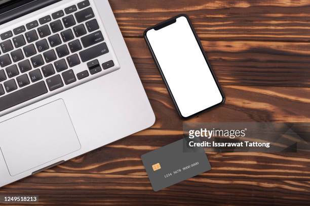 office stuff with laptop,credit card and smart phone .top view .online shopping concept. - credit card mockup stock pictures, royalty-free photos & images