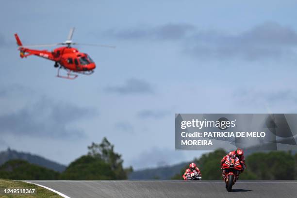 Ducati Italian rider Francesco Bagnaia and Aprilia Spanish rider Maverick Vinales compete in the MotoGP race of the Portuguese Grand Prix at the...