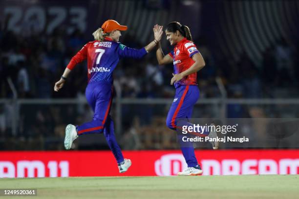 Radha Yadav of Delhi Capitals celebrates the wicket of Yastika Bhatia of Mumbai Indians during the Women's Premier League final match between Delhi...