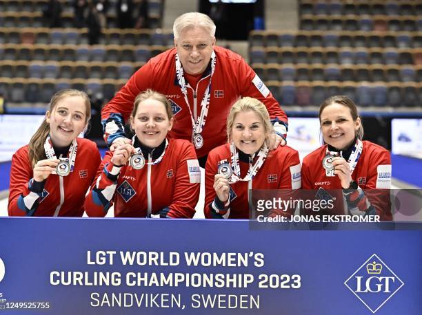 Silver medalists Norway's Martine Ronning, Mille Haslev Nordby, Kristin Skaslien and Marianne Rorvik pose after the LGT World Womens Curling...
