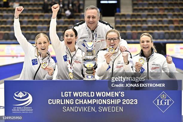 Gold medalists Switzerland's Briar Schwaller-Huerlimann, Carole Howald, Alina Patz and Silvana Tirinzoni pose after the LGT World Womens Curling...