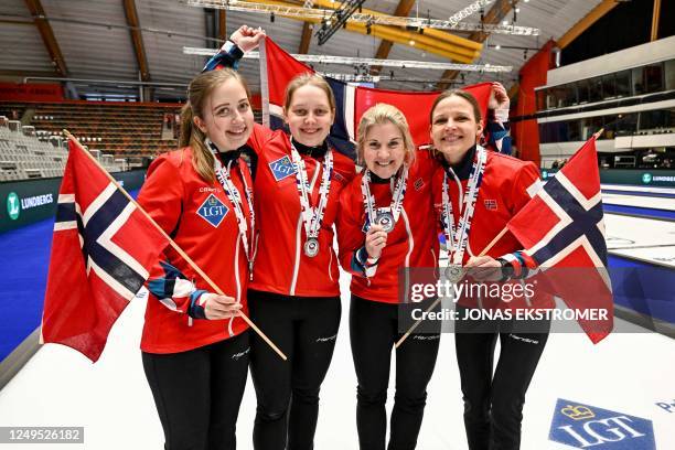 Silver medalists Norway's Martine Ronning, Mille Haslev Nordby, Kristin Skaslien and Marianne Rorvik pose after the LGT World Womens Curling...