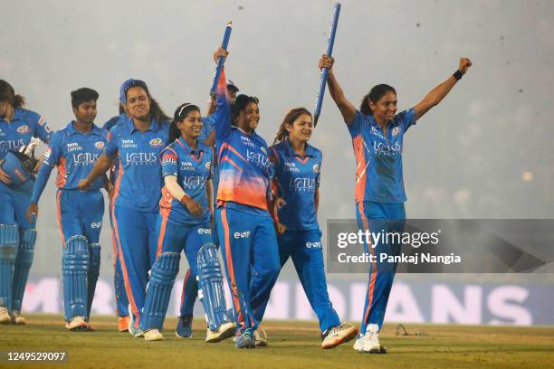 Harmanpreet Kaur captain of Mumbai Indians with teammates celebrate their victory during the Women's Premier League final match between Delhi...