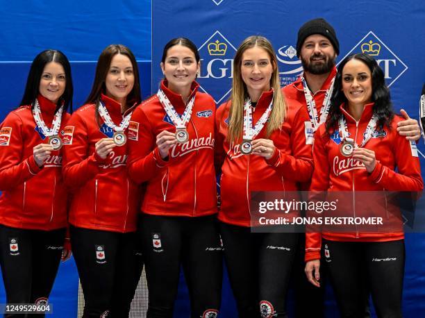 Bronze medalists Canada's Kerri Einarson, Val Sweeting, Shannon Birchard, Briane Harris and Krysten Karwacki pose after the LGT World Womens Curling...
