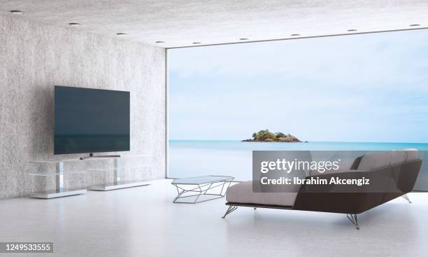 minimalist living room with sea view - television stand stock pictures, royalty-free photos & images