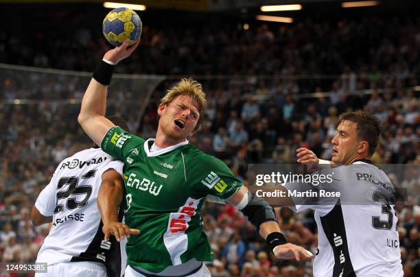 Momir Ilic of Kiel challens Manuel Spaeth of Goeppingen during the Toyota Handball Bundesliga match between THW Kiel and Frisch Auf Goeppingen at the...