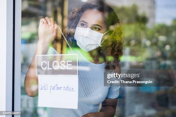 small business owner affected by covid-19 - global epidemic stock pictures, royalty-free photos & images