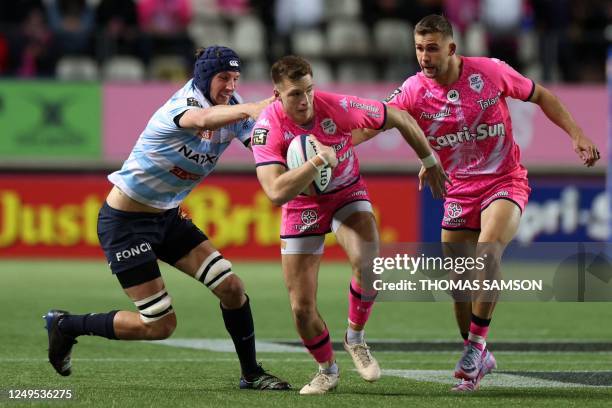 Stade Francais French fly-half Leo Barre runs with the ball during the French Top 14 match between Stade Français and Racing 92 at Jean Bouin Stadium...