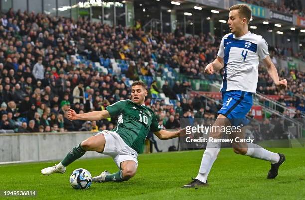 Belfast , United Kingdom - 26 March 2023; Dion Charles of Northern Ireland in action against Robert Ivanov of Finland during the UEFA EURO 2024...