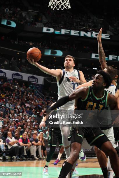 Luka Doncic of the Dallas Mavericks drives to the basket during the game against the Charlotte Hornets on March 26, 2023 at Spectrum Center in...