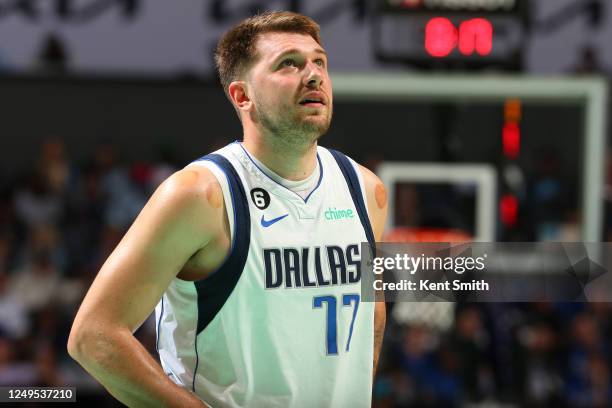 Luka Doncic of the Dallas Mavericks looks on during the game against the Charlotte Hornets on March 26, 2023 at Spectrum Center in Charlotte, North...