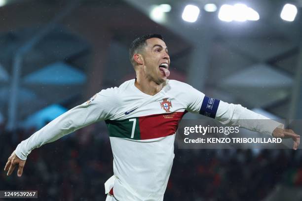 Portugal's forward Cristiano Ronaldo celebrates after scoring his team's first goal during the UEFA Euro 2024 group J qualification football match...