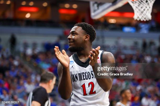 Darrion Trammell of the San Diego State Aztecs celebrates drawing a charge from the Creighton Bluejays during the Elite Eight round of the 2023 NCAA...