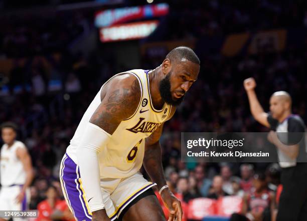 LeBron James of the Los Angeles Lakers reacts after getting hit in the face by Nikola Vucevic of the Chicago Bulls during the first half at...