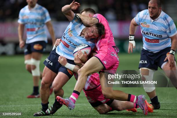 Racing92s French hooker Janick Tarrit is tackled during the French Top 14 match between Stade Français and Racing 92 at Jean Bouin Stadium in Paris...