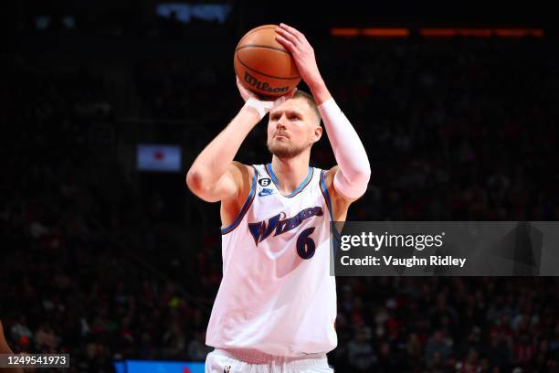 Kristaps Porzingis of the Washington Wizards shoots the ball during the game against the Toronto Raptors on March 26, 2023 at the Scotiabank Arena in...