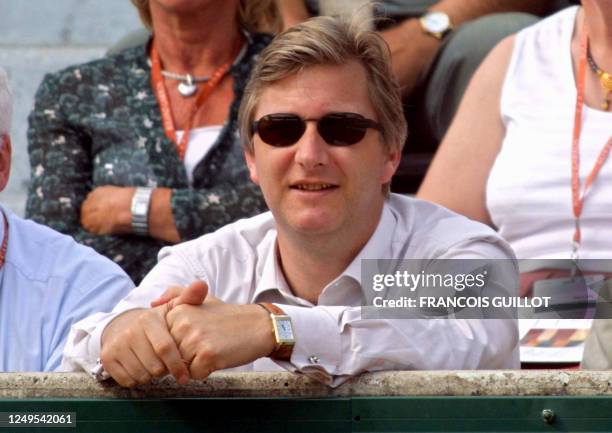 Prince Philippe of Belgium watch the quarter-final match opposing Belgium Kim Clijsters to Hungarian Petra Mandula 05 June 2001, at the French tennis...