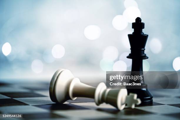 chess pieces on a chessboard - norway chess stock pictures, royalty-free photos & images