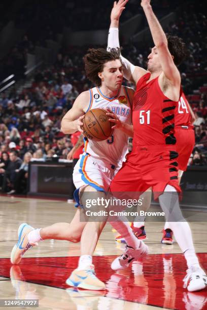 Josh Giddey of the Oklahoma City Thunder drives to the basket during the game against the Toronto Raptors on March 26, 2023 at the Moda Center Arena...