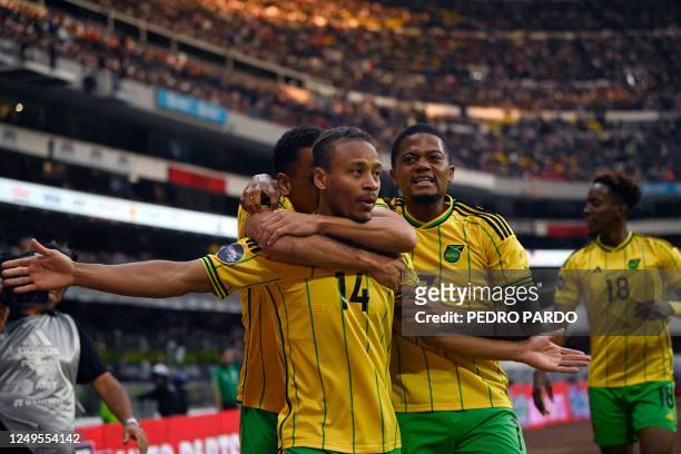 Jamaica's midfielder Bobby Reid celebrates with teammates Ravel Morrison and Leon Bailey after scoring a goal during the Concacaf Nations League...
