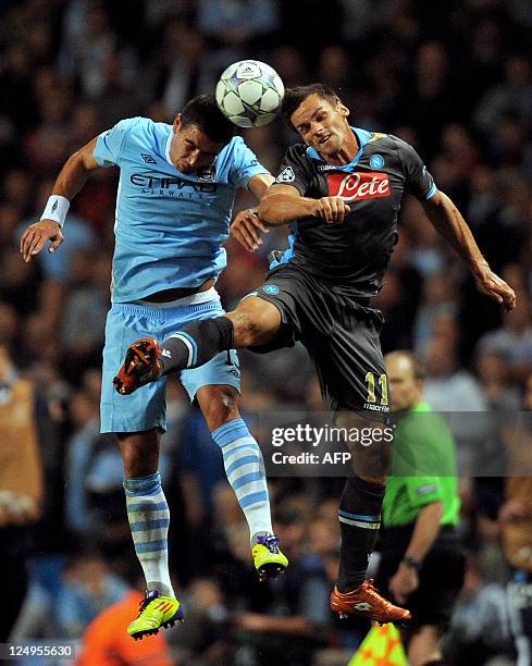 Napoli's Italian midfielder Christian Maggio vies with Manchester City's Serbian defender Aleksandar Kolarov during the UEFA Champions league group A...