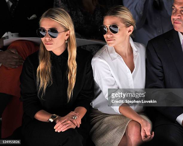 Mary-Kate Olsen and Ashley Olsen attend the J.Mendel Spring 2012 Fashion Show at Lincoln Center on September 14, 2011 in New York City.