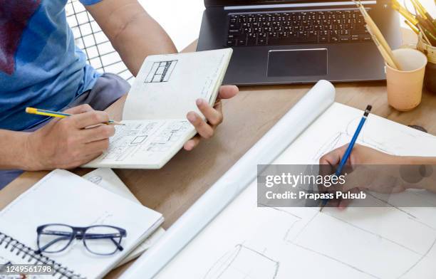 production designer sketching drawing development process prototype design idea creative concept - product development stockfoto's en -beelden