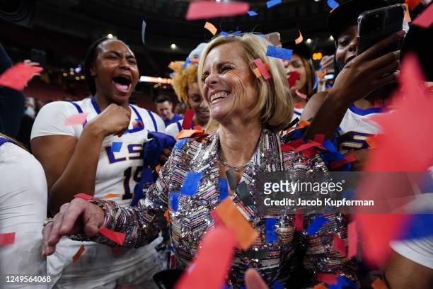 Head coach Kim Mulkey of the LSU Lady Tigers celebrates with her team after defeating the Miami Hurricanes and earning a spot in the Final Four....