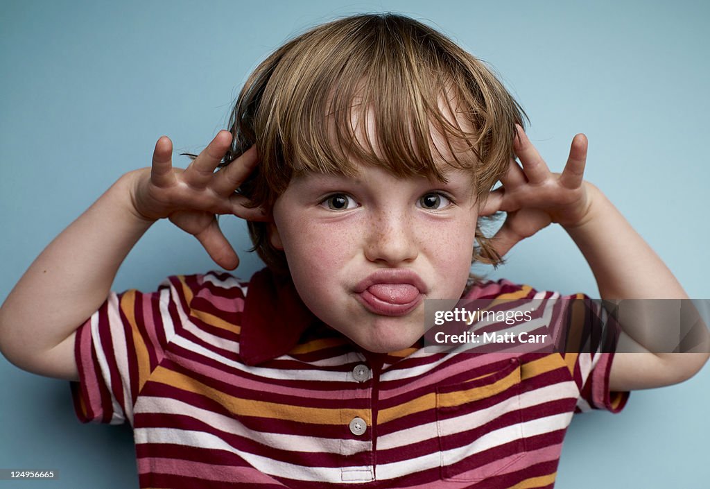 Young Boy making face