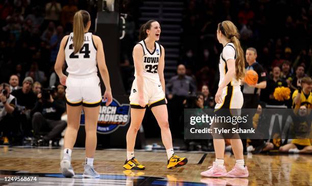 Caitlin Clark of the Iowa Hawkeyes celebrates with the teammates in the second half of the game against the Louisville Cardinals during the Elite...