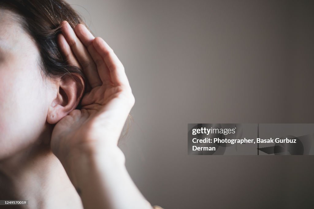 A woman's ear, listening