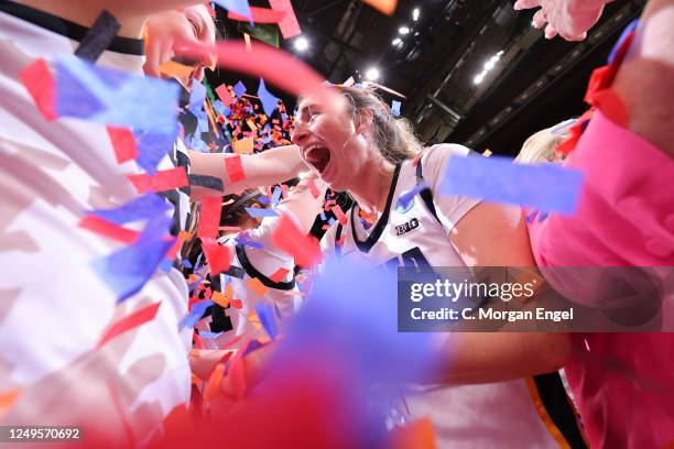 Kate Martin of the Iowa Hawkeyes celebrates after defeating Louisville Cardinals during the Elite Eight round of the 2023 NCAA Women's Basketball...
