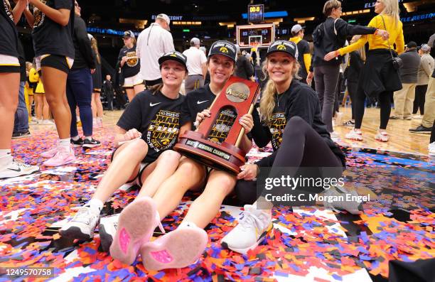 The Iowa Hawkeyes celebrate after the game against the Louisville Cardinals during the Elite Eight round of the 2023 NCAA Women's Basketball...