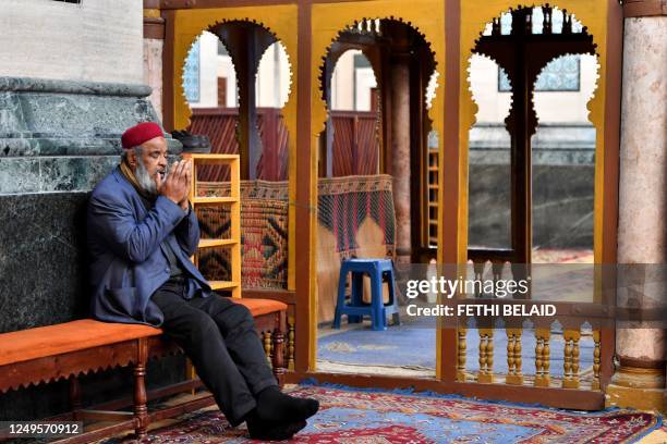 Picture taken on March 26 shows a man praying during the Muslim holy fasting month of Ramadan at the Sidi Mahrez mosque in the Bab Souika district...