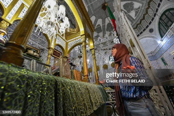 Picture taken on March 26 shows a woman praying during the Muslim holy fasting month of Ramadan at the Sidi Mahrez mosque in Tunis' Bab Souika...