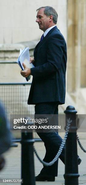 British Defence Secretary Geoff Hoon arrives at the Hutton Inquiry at the Royal Courts of Justice in London 22 September, 2003 after being called...