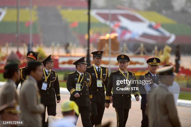 Chinese military officers attend a ceremony to mark Myanmar's 78th Armed Forces Day in Naypyidaw on March 27, 2023.