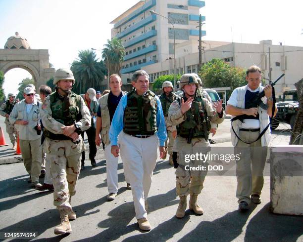 This US Department of Defense photo shows US Deputy Defense Secretary Paul Wolfowitz accompanying 1st Armored Division soldiers on a patrol in the...