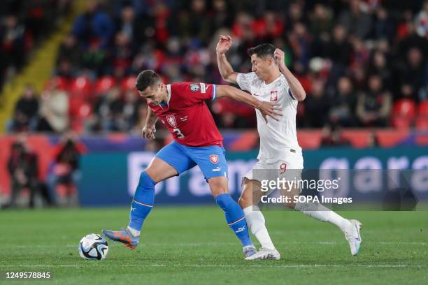 Tomas Holes of Czech Republic and Robert Lewandowski of Poland in action during the European Championship 2024-Qualifying round Match between Czech...