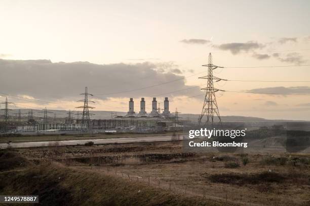High voltage electricity transmission towers next to Connah's Quay power station, operated by Uniper SE, in Flint, UK, on Tuesday, Jan. 31, 2023....